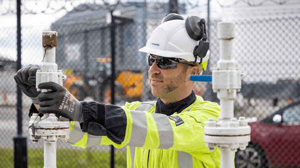 A Penspen employee inspecting pipework on site.